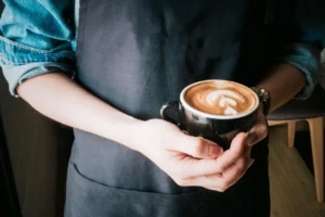 a boy Holding Mug of coffy