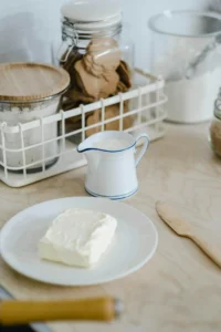 A Butter on a Saucer and milk