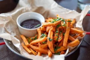 a fried potato chips with souce example of junk food