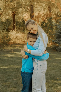 a mother giving hug to her adolescent son stages of adolescence images