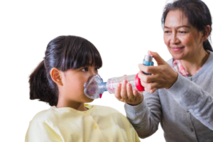 a mother giving inhalerl dose to her doughter by using spacer and baby mask in asthama attack